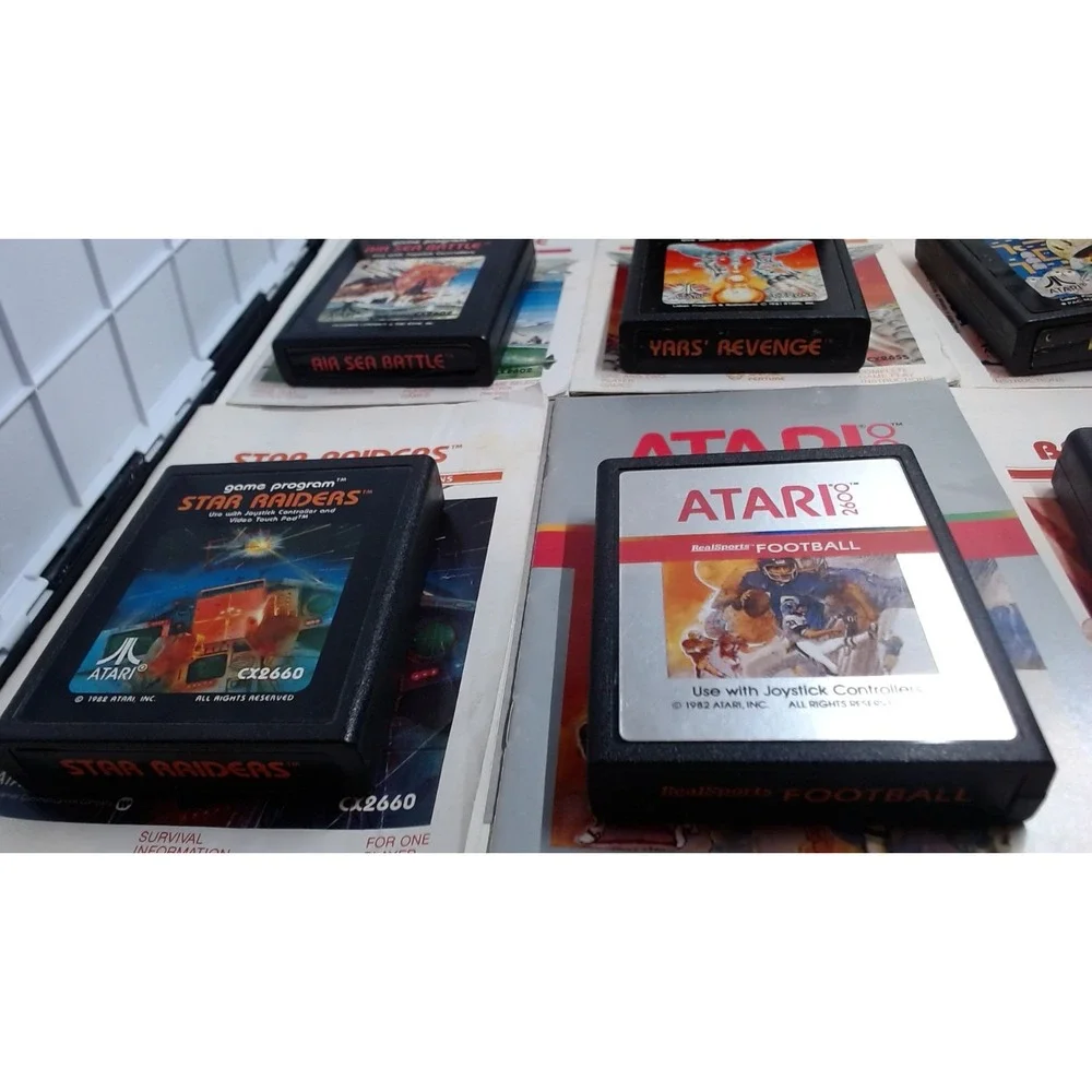 Lot of 7 Atari 2600 Games with Manuals Star Raiders Pac-Man Yars Revenge NTSC